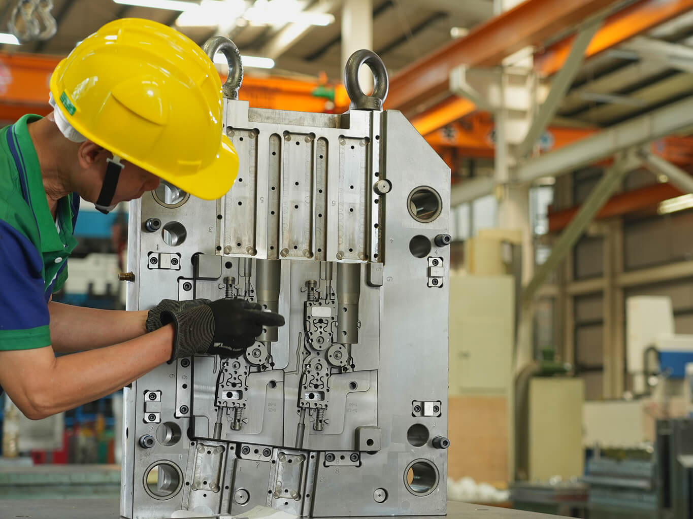 mold safety standards — assembled injection mold on tool room bench with standard utility connections